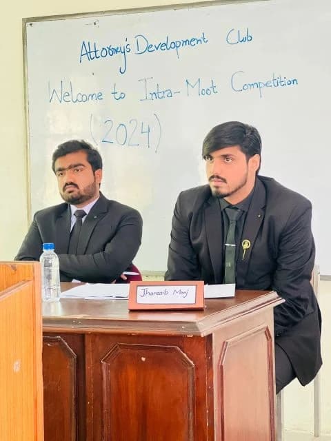 Faiz adjudicating a moot court competition at Punjab University Law College